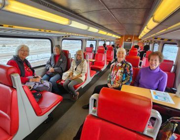 Group of women riding the Rail Runner train